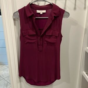 Women’s v-neck magenta blouse.